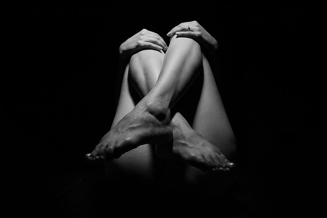 legs of a woman on a dark background