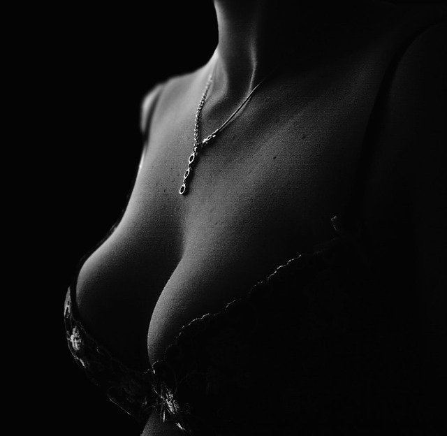 woman’s breasts in a play of shadow and light